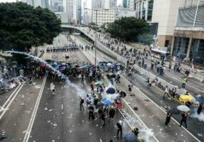 Protesters throw back a tear gas canister fired by police during a rally against a controversial extradition law proposal outside the government headquarters in Hong Kong on June 12, 2019. - Violent clashes broke out in Hong Kong on June 12 as police tried to stop protesters storming the city's parliament, while tens of thousands of people blocked key arteries in a show of strength against government plans to allow extraditions to China. (Photo by DALE DE LA REY / AFP)DALE DE LA REY/AFP/Getty Images