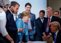 Canada's Prime Minister Justin Trudeau and G7 leaders Britain's Prime Minister Theresa May, France's President Emmanuel Macron, Germany's Chancellor Angela Merkel, and U.S. President Donald Trump discuss the joint statement following a breakfast meeting on the second day of the G7 meeting in Charlevoix city of La Malbaie, Quebec, Canada, June 9, 2018.  Adam Scotti/Prime Minister's Office/Handout via REUTERS. ATTENTION EDITORS - THIS IMAGE WAS PROVIDED BY A THIRD PARTY.